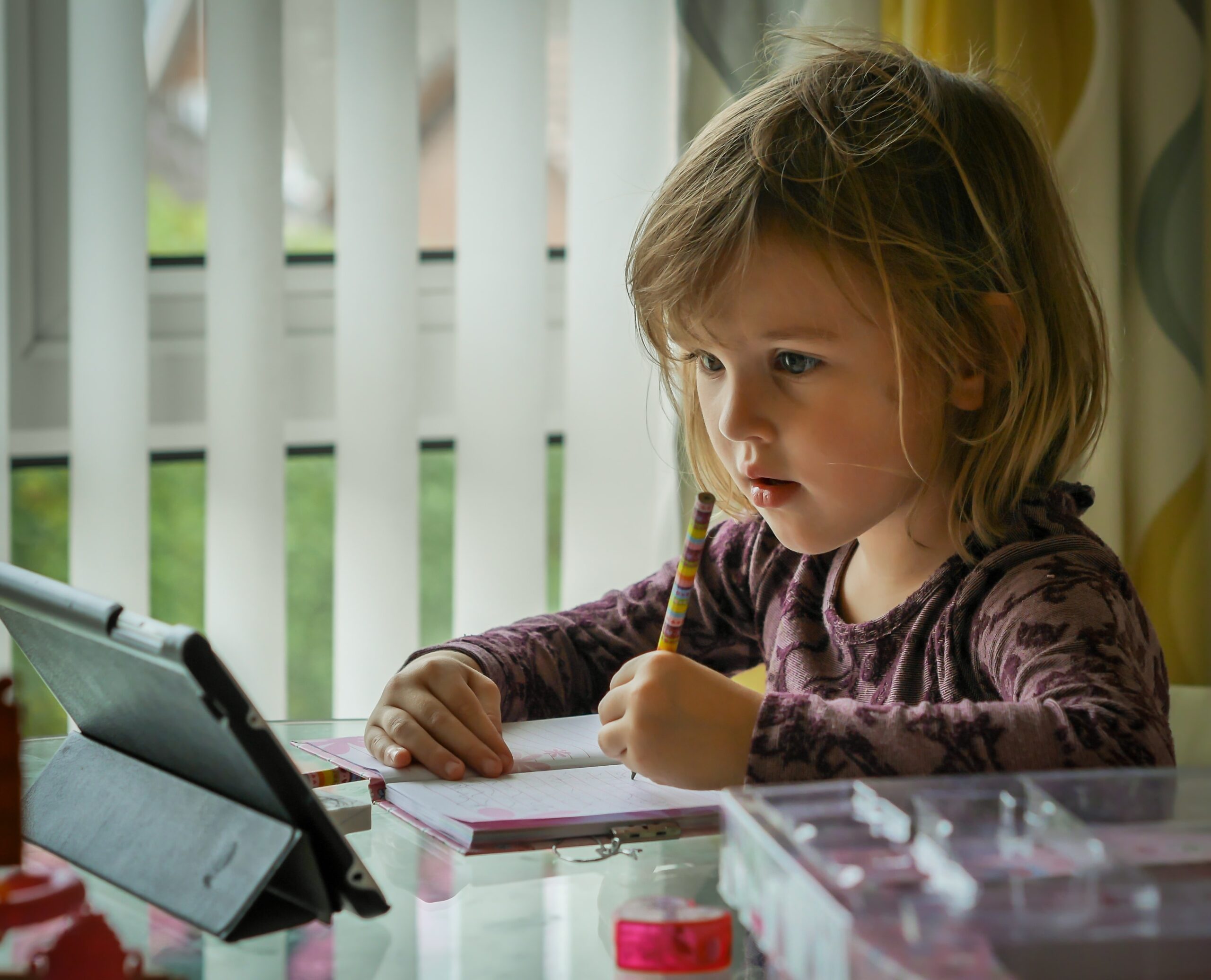 image showing child learning using a tablet for a digital school experience